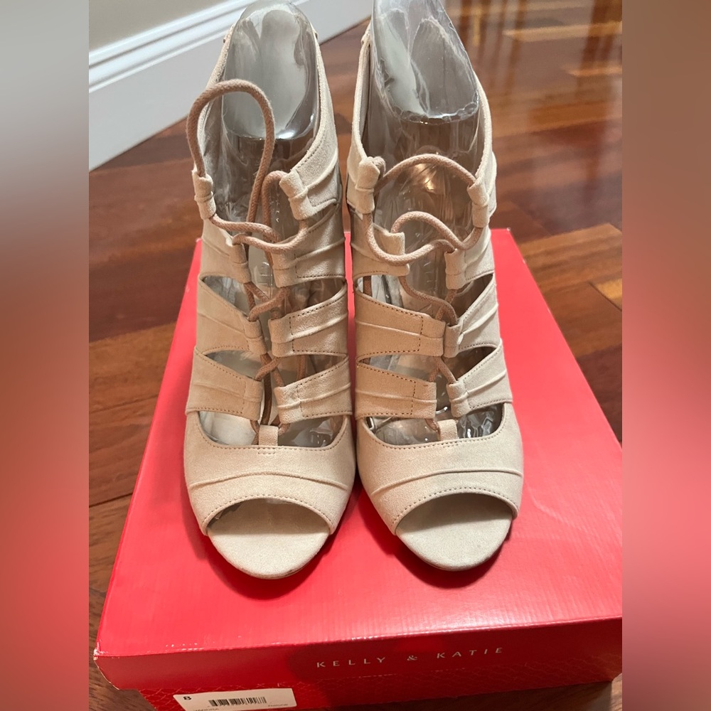 Tan Suede lace up bootie.